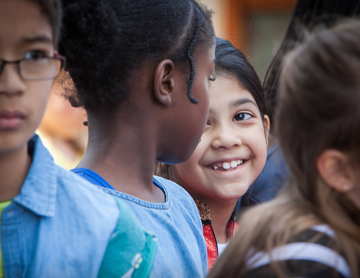 Children smiling at each other