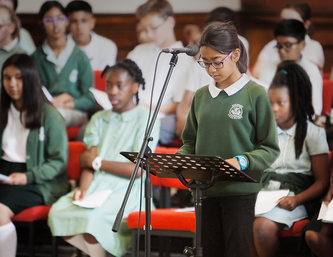 Girl reading at lectern